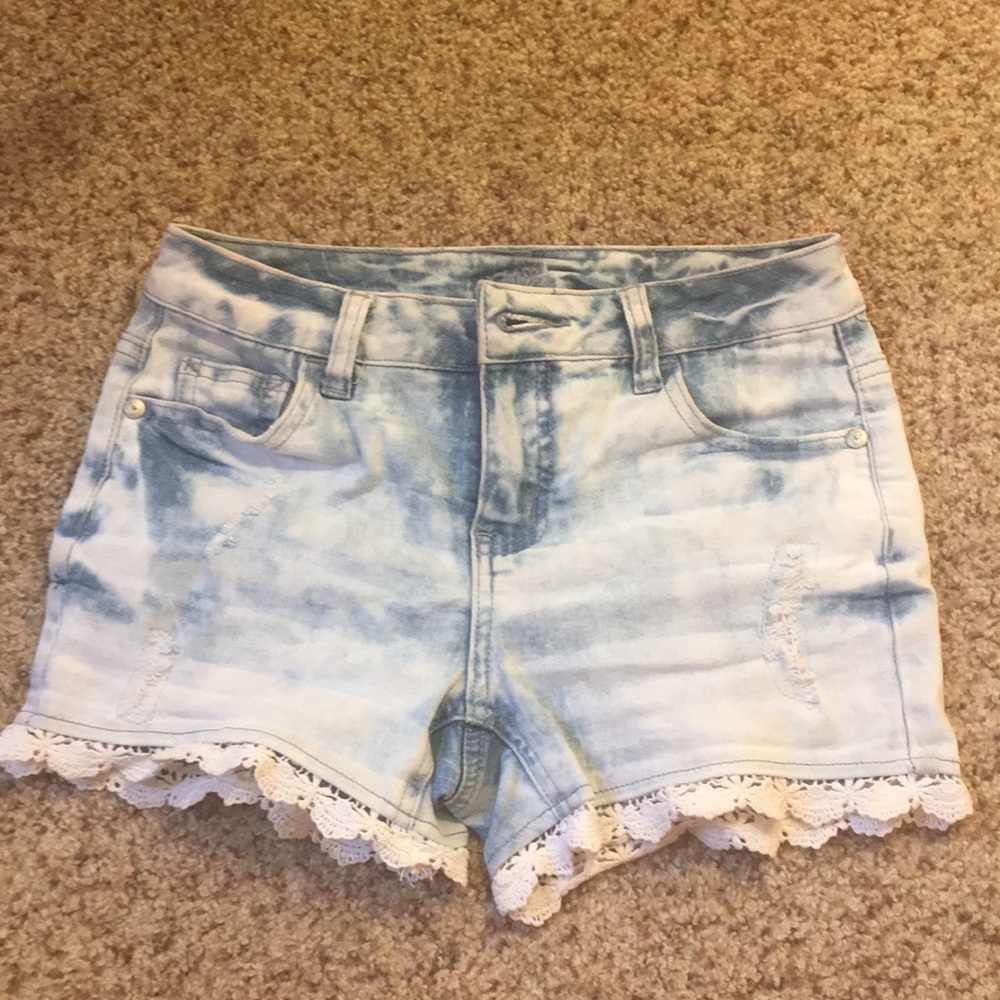 light wash lace shorts with small rips
